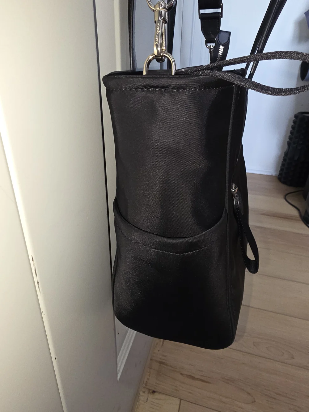 kate spade black tote with gold-tone logo and zipper